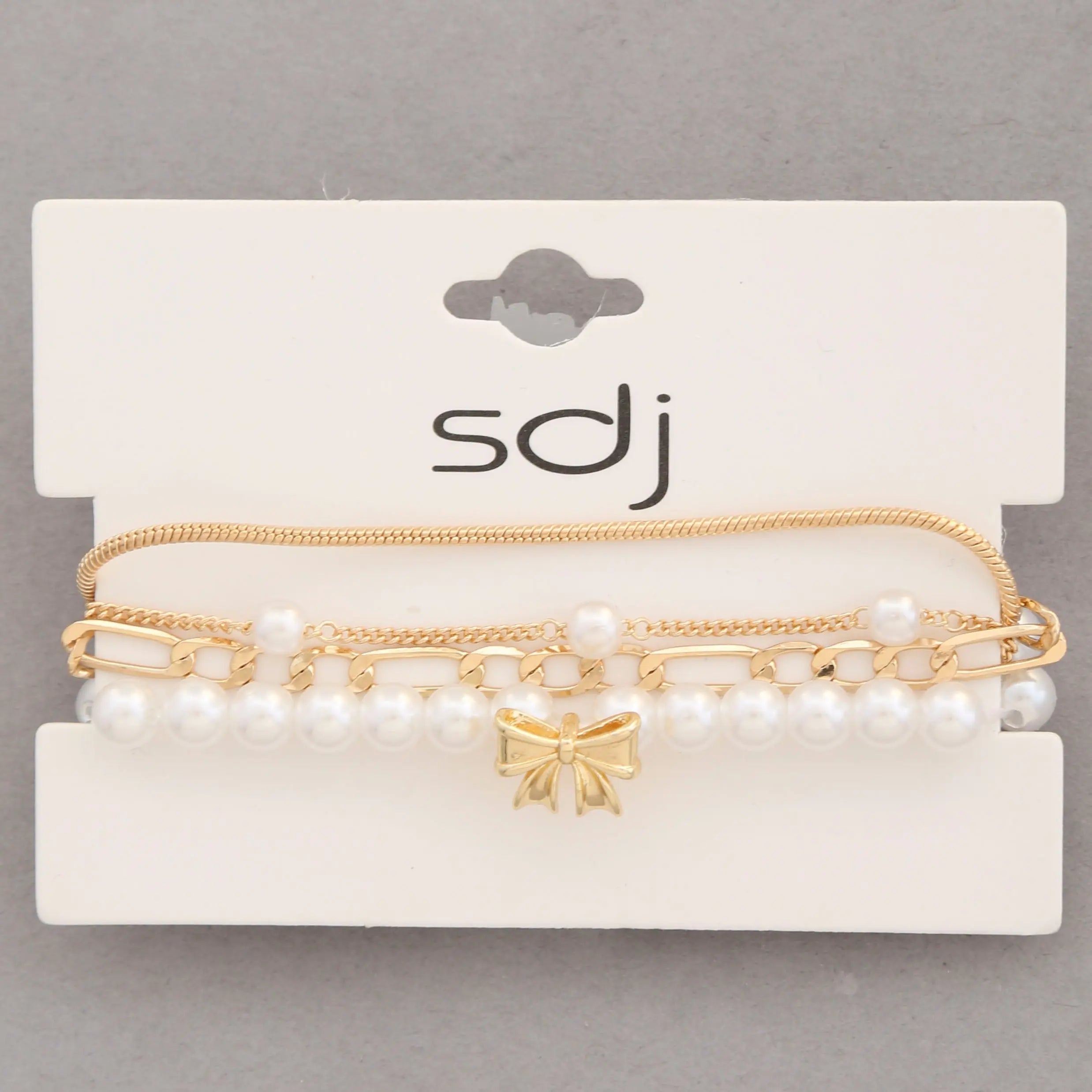 Joia Accessories Alma Layered Bracelet – Pearl, Gold & Bow Detail JOIA TRADING CO.