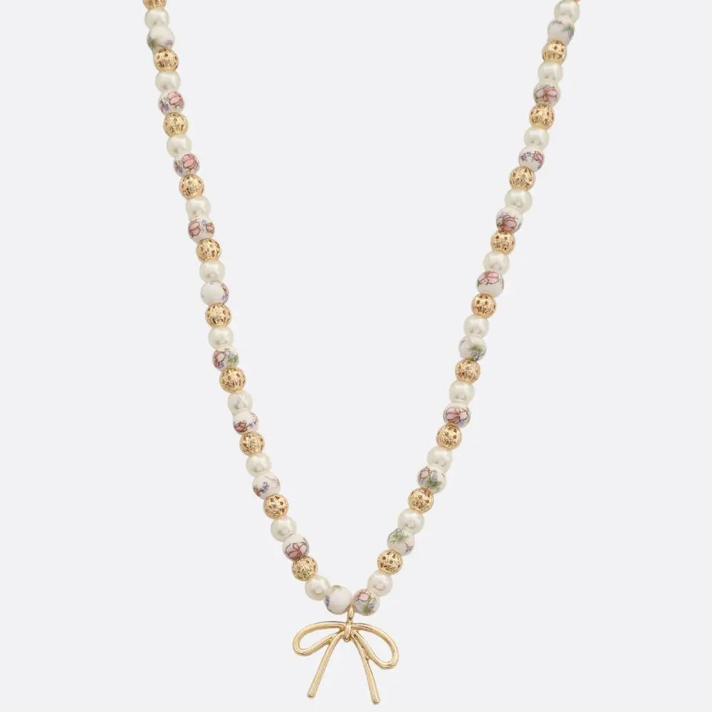 Joia Accessories Eloise Beaded Necklace – Elegant Bow Pendant    JOIA TRADING CO.
